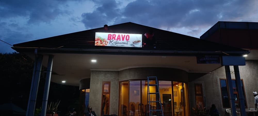 Illuminated restaurant signage at night
